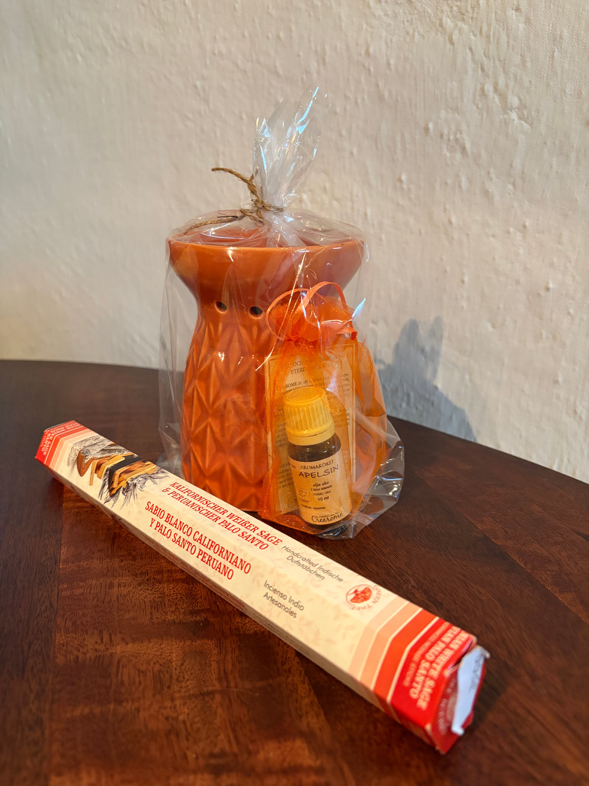 En Aromalykta med en Aromaessens Apelsin